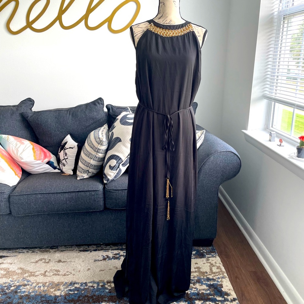 Black maxi dress with gold detail. Side slits for easy walking & with a tie